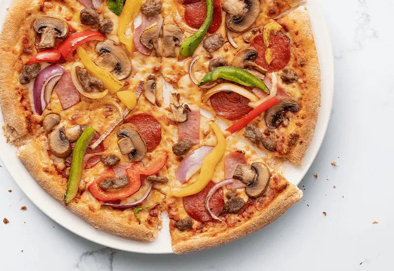 pizza extravaganzza - Qué precio tiene la pizza extra grande